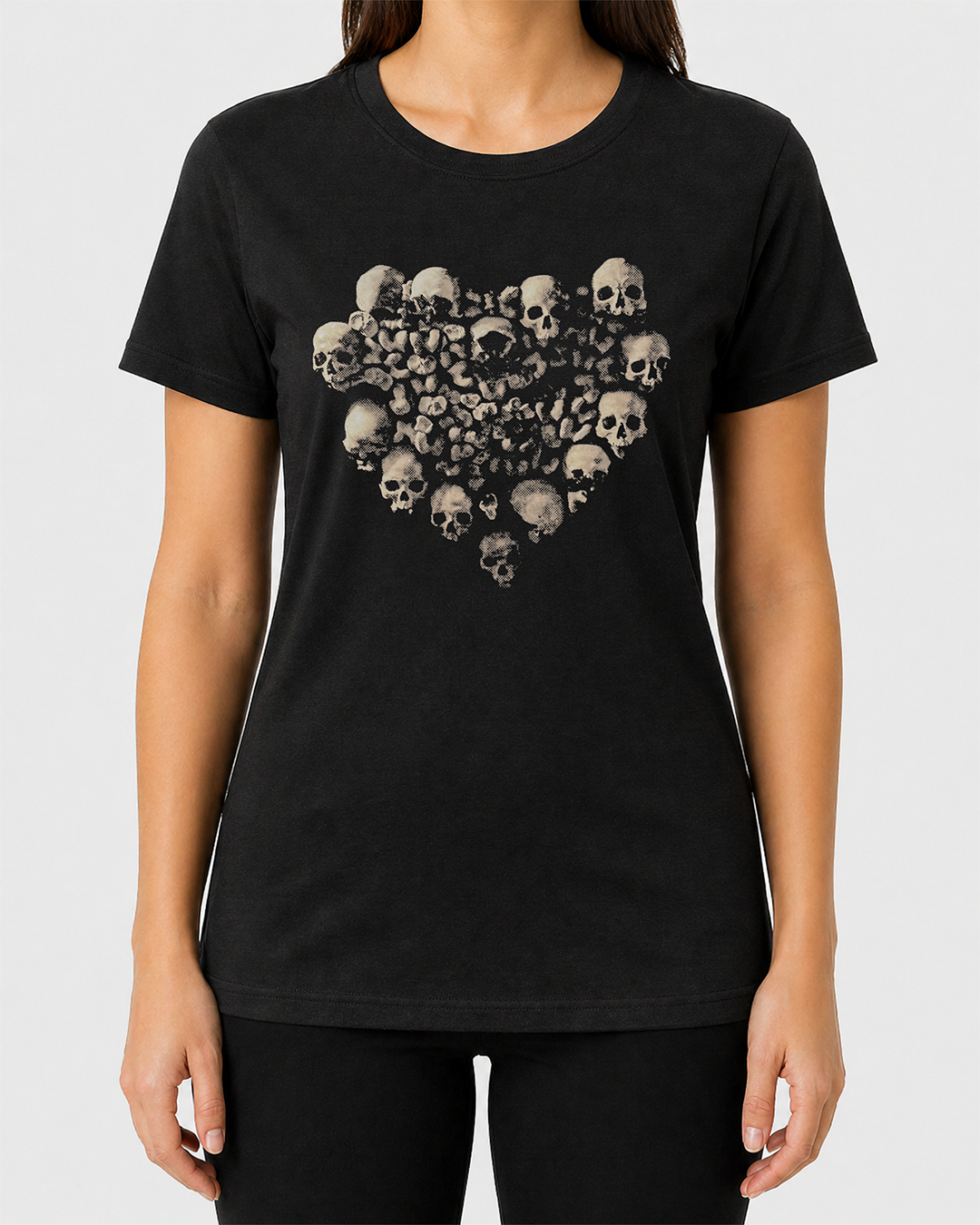 Black t-shirt with skull heart design worn by a person on a white background